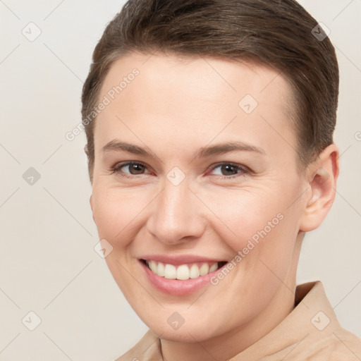 Joyful white young-adult female with short  brown hair and brown eyes