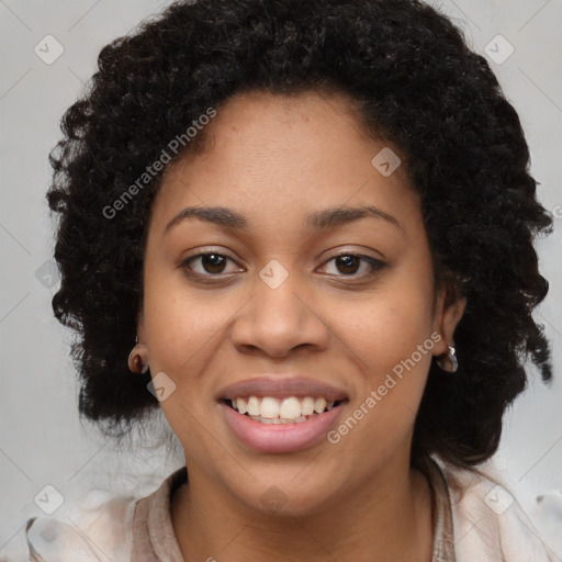 Joyful black young-adult female with long  brown hair and brown eyes