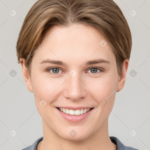 Joyful white young-adult female with short  brown hair and grey eyes