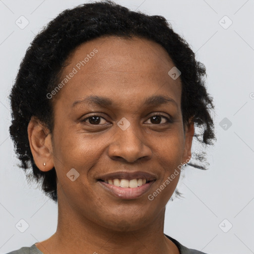 Joyful black young-adult female with short  brown hair and brown eyes