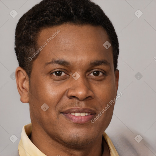 Joyful latino young-adult male with short  brown hair and brown eyes