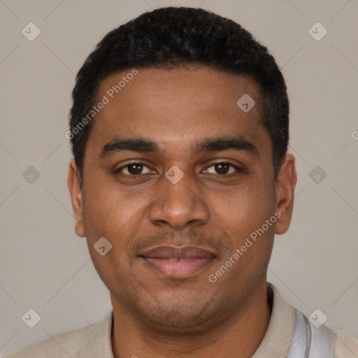 Joyful black young-adult male with short  black hair and brown eyes