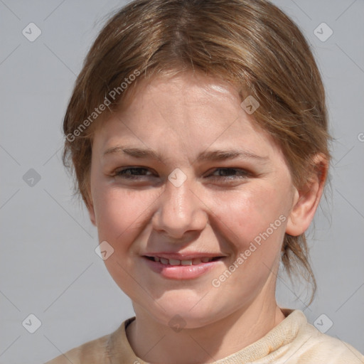 Joyful white adult female with medium  brown hair and brown eyes