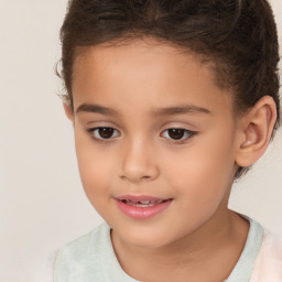 Joyful white child female with short  brown hair and brown eyes