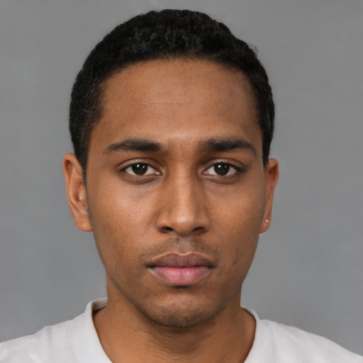 Neutral black young-adult male with short  black hair and brown eyes