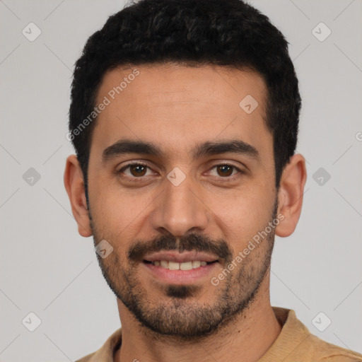 Joyful latino young-adult male with short  black hair and brown eyes