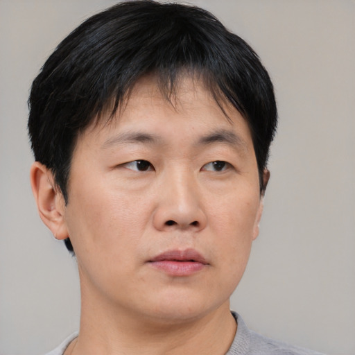 Neutral asian young-adult male with short  black hair and brown eyes