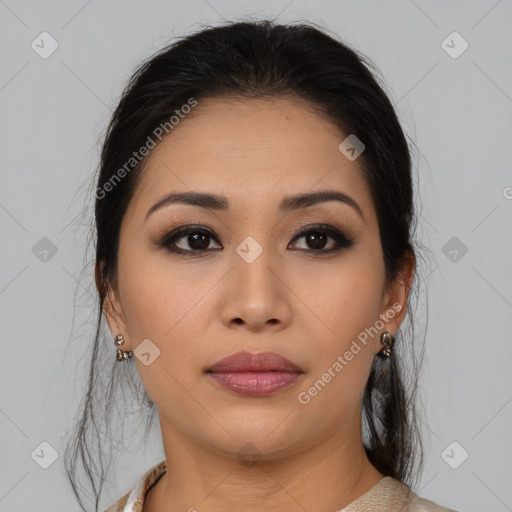 Joyful latino young-adult female with medium  brown hair and brown eyes