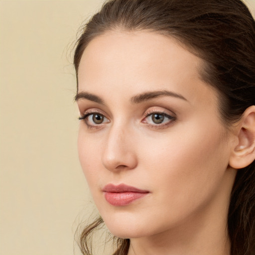 Neutral white young-adult female with long  brown hair and brown eyes