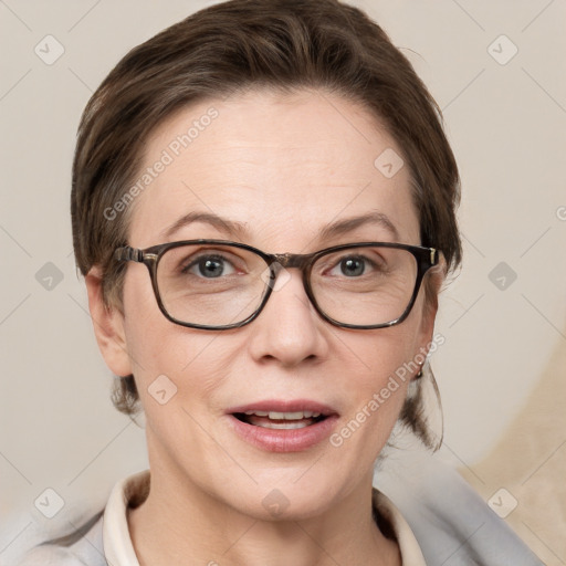 Joyful white adult female with medium  brown hair and grey eyes