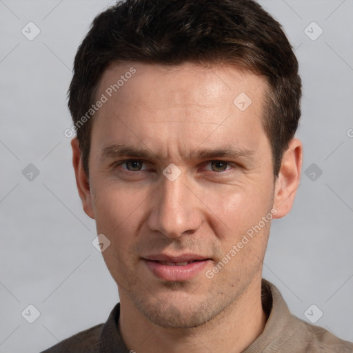 Joyful white adult male with short  brown hair and grey eyes