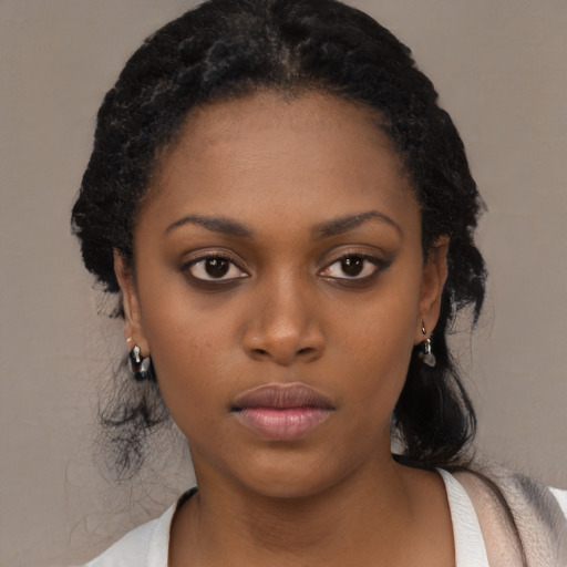Neutral black young-adult female with medium  black hair and brown eyes