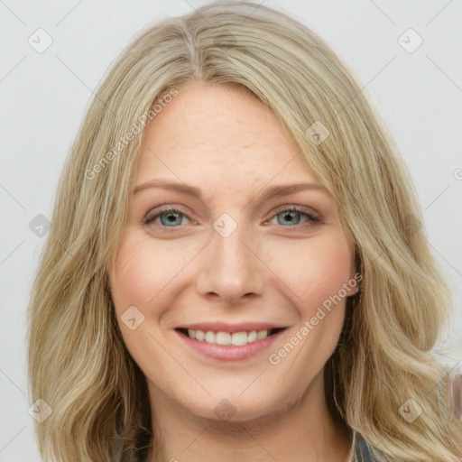 Joyful white young-adult female with long  brown hair and blue eyes