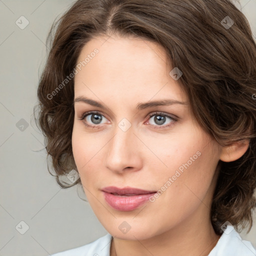 Joyful white young-adult female with medium  brown hair and green eyes