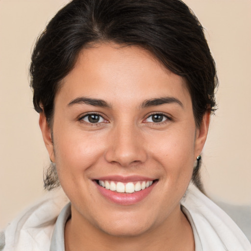 Joyful white young-adult female with medium  brown hair and brown eyes