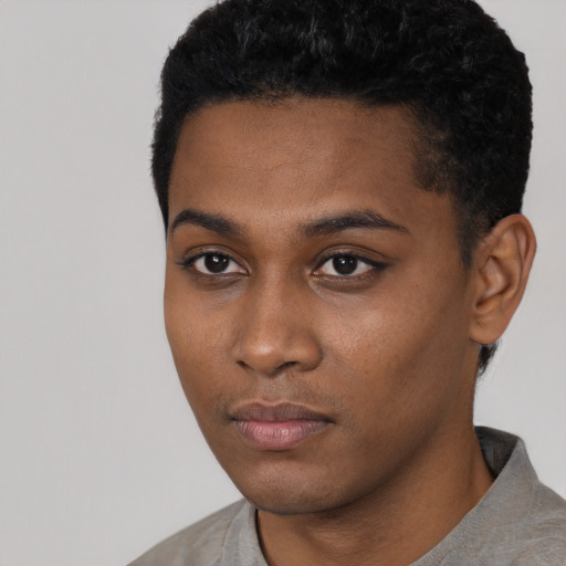 Neutral black young-adult male with short  black hair and brown eyes