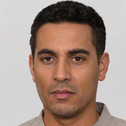 Neutral white young-adult male with short  black hair and brown eyes