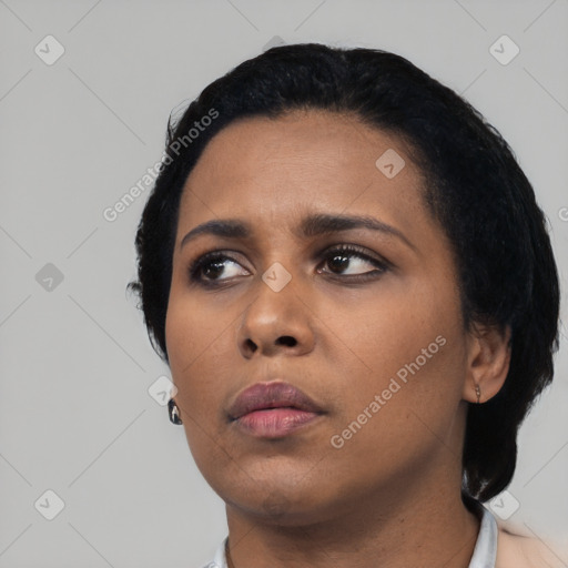 Neutral black young-adult female with short  black hair and brown eyes