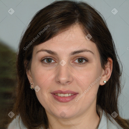 Joyful white adult female with medium  brown hair and brown eyes