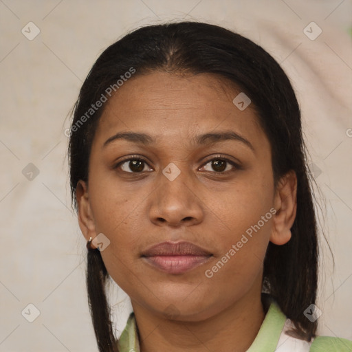Joyful latino adult female with medium  brown hair and brown eyes