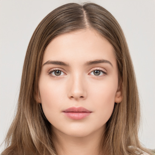 Neutral white young-adult female with long  brown hair and brown eyes