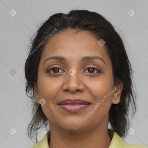 Joyful latino adult female with medium  brown hair and brown eyes