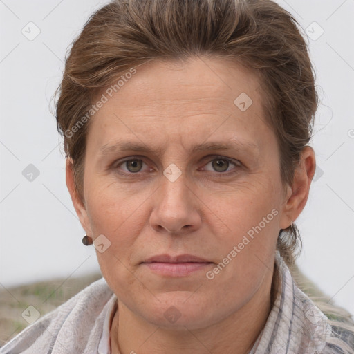 Joyful white adult female with short  brown hair and grey eyes