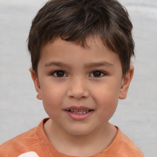 Joyful white child male with short  brown hair and brown eyes
