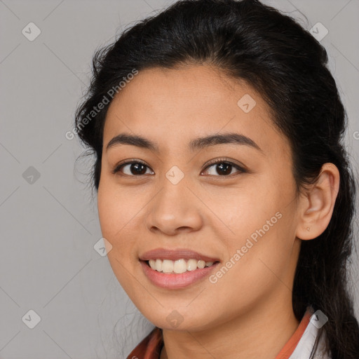 Joyful latino young-adult female with long  brown hair and brown eyes