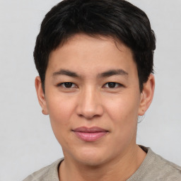 Joyful asian young-adult male with short  brown hair and brown eyes