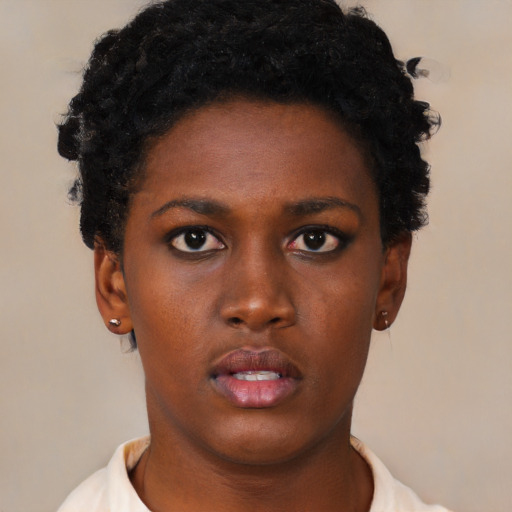Neutral black young-adult female with short  black hair and brown eyes