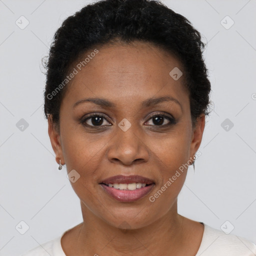 Joyful black adult female with short  brown hair and brown eyes