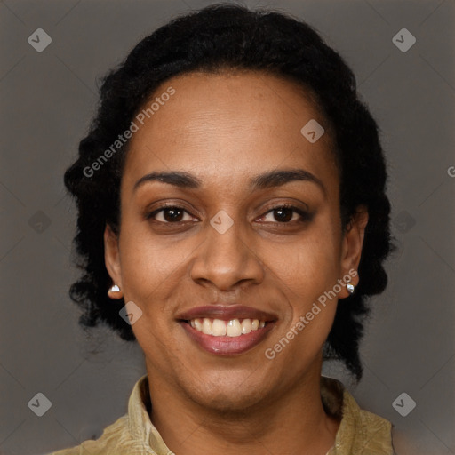 Joyful black young-adult female with long  black hair and brown eyes