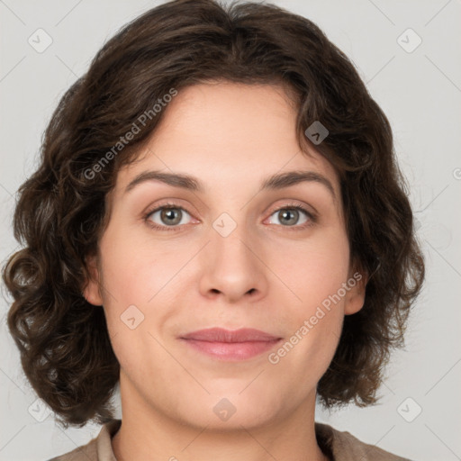 Joyful white young-adult female with medium  brown hair and green eyes