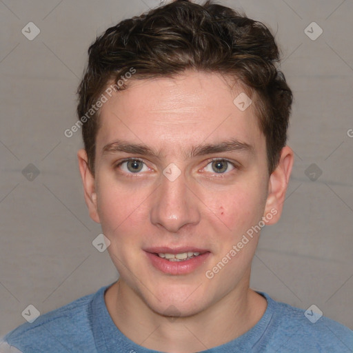 Joyful white young-adult male with short  brown hair and blue eyes