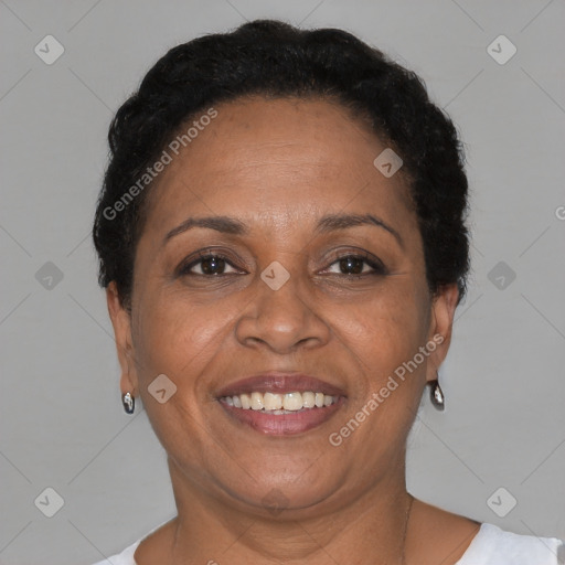 Joyful black adult female with short  brown hair and brown eyes