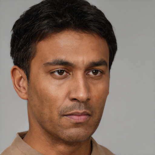 Neutral latino young-adult male with short  brown hair and brown eyes