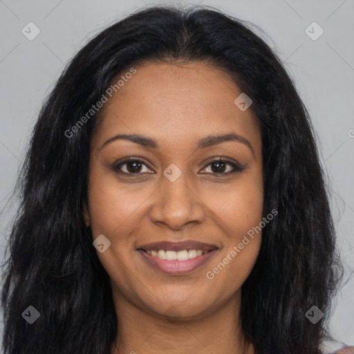 Joyful black young-adult female with long  brown hair and brown eyes