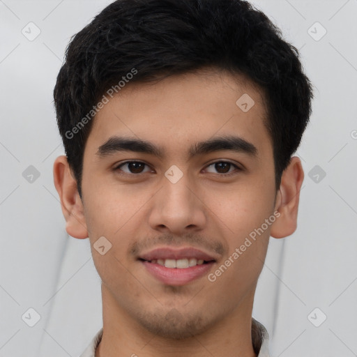 Joyful latino young-adult male with short  brown hair and brown eyes