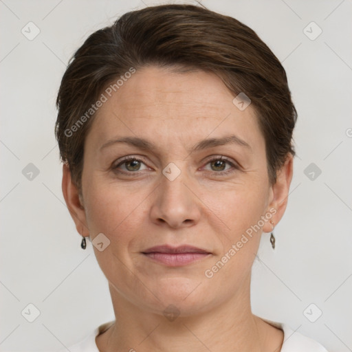 Joyful white adult female with short  brown hair and grey eyes