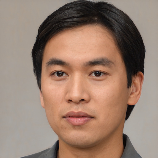 Neutral asian young-adult male with short  black hair and brown eyes