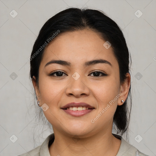 Joyful asian young-adult female with medium  black hair and brown eyes