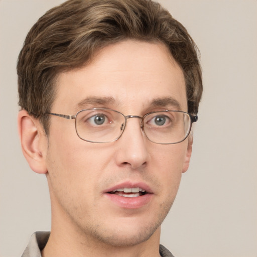 Joyful white adult male with short  brown hair and grey eyes