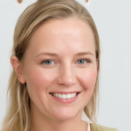 Joyful white young-adult female with long  brown hair and blue eyes