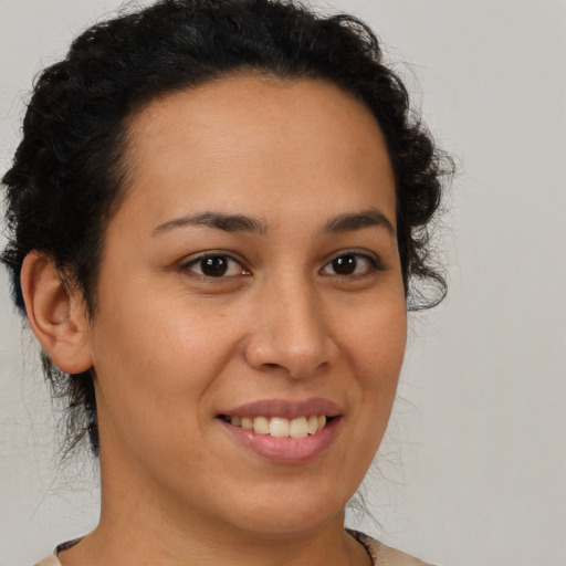 Joyful latino young-adult female with short  brown hair and brown eyes