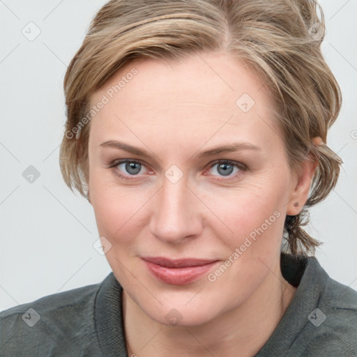 Joyful white young-adult female with medium  brown hair and blue eyes