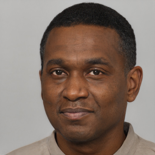 Neutral black adult male with short  black hair and brown eyes