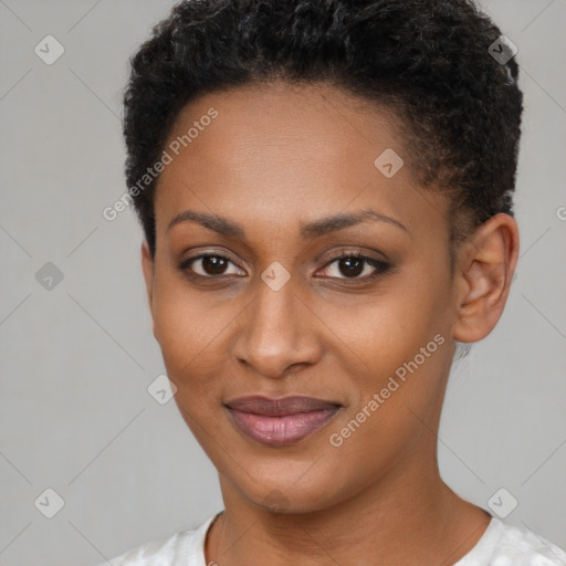 Joyful black young-adult female with short  brown hair and brown eyes