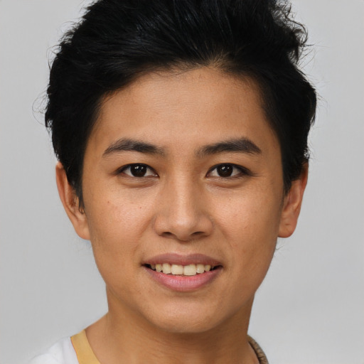 Joyful asian young-adult female with short  brown hair and brown eyes