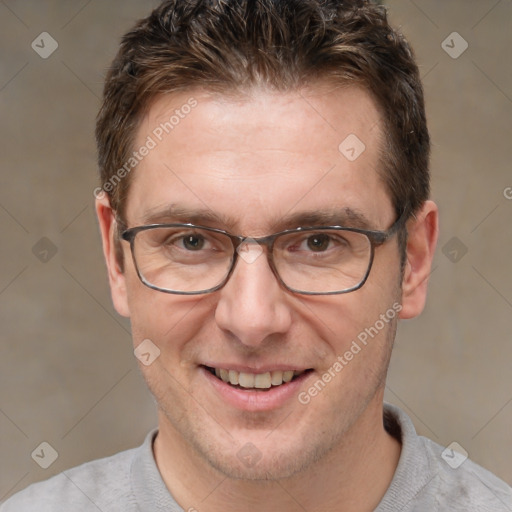 Joyful white adult male with short  brown hair and brown eyes